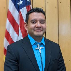 Town of Taos Mayor Pascual Maestas, a Navy Veteran, holds a wristband